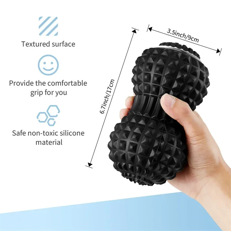 Hand holding Motyx black textured silicone massage roller, 6.7x3.5 inches, non-toxic material.