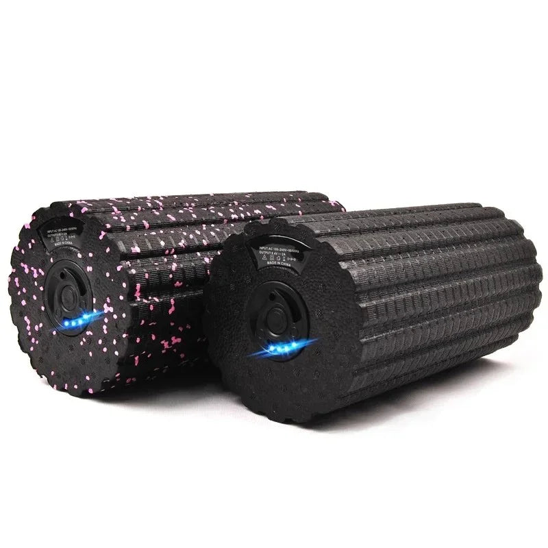 Motyx black foam rollers with pink speckles and LED lights on white background